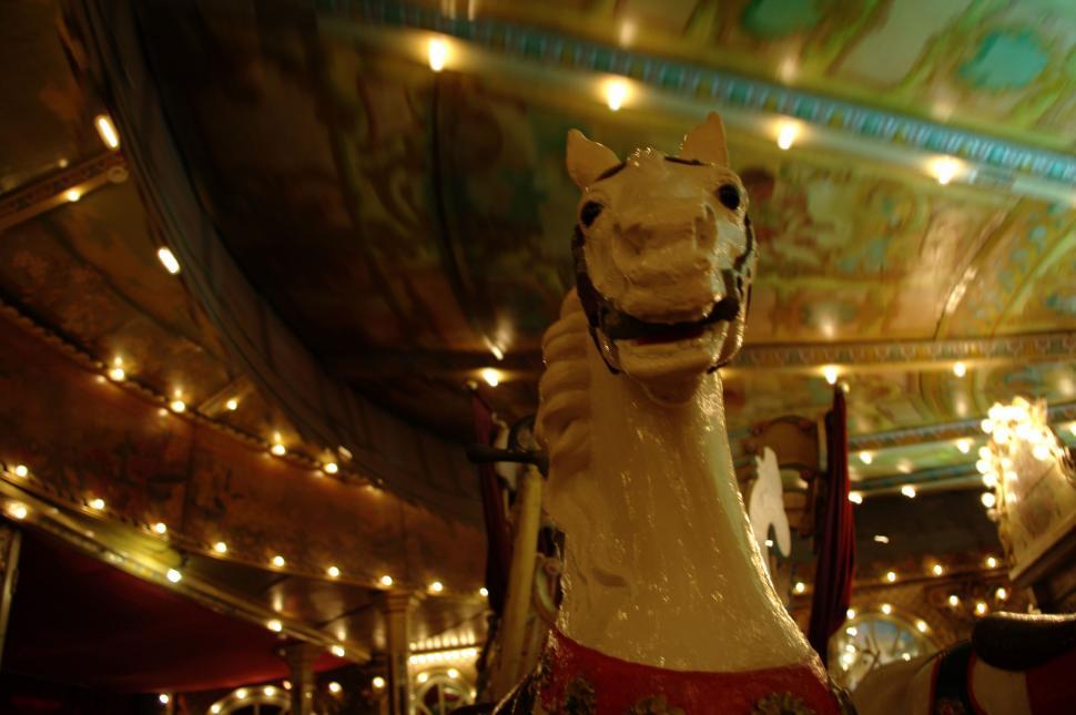 Free Image of Horse Statue in the Center of Carousel 