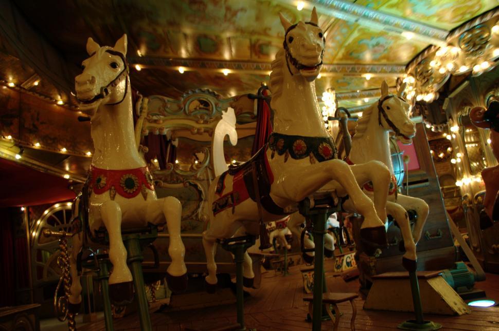 Free Image of Colorful Merry Go Round With Multiple Horses 