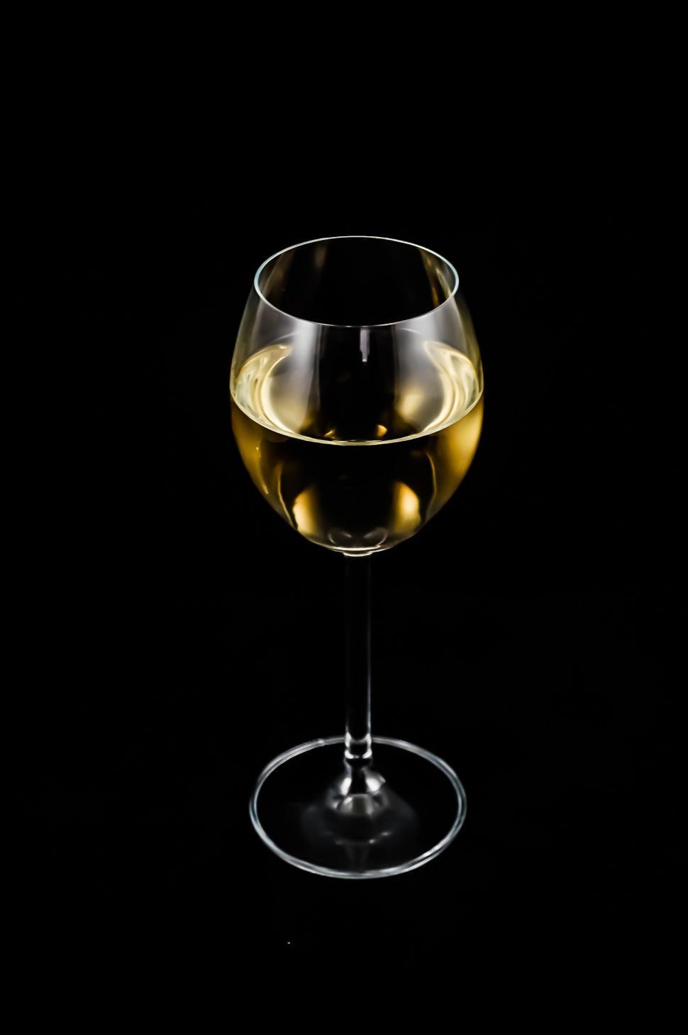 Free Image of Glass of White Wine on Black Background 