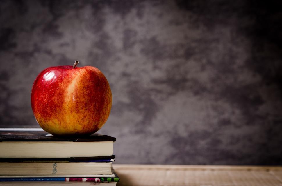 Free Image of Red Apple on Stack of Books 