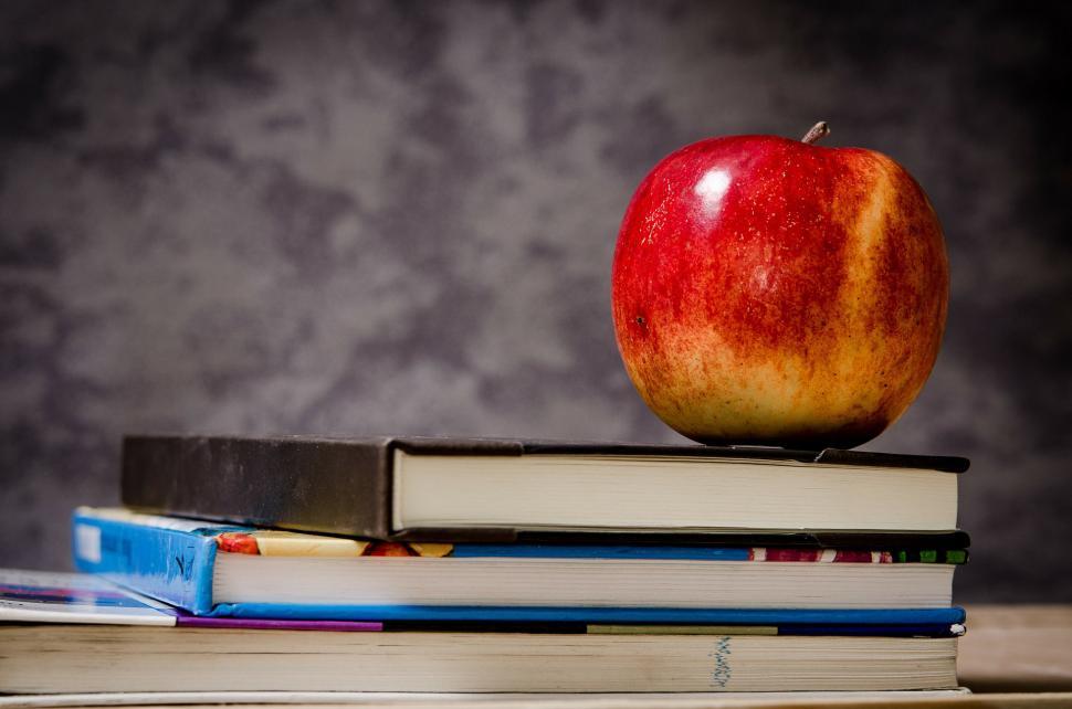 Free Image of Red Apple on Top of Pile of Books 