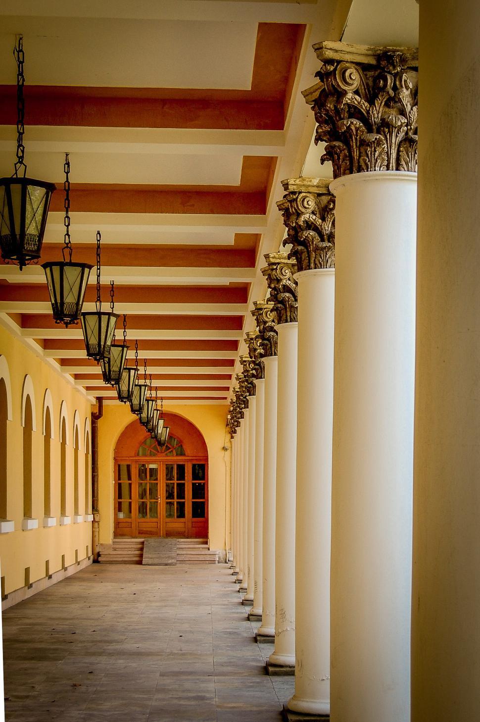 Free Image of Grand Hallway With Columns and Lamps 
