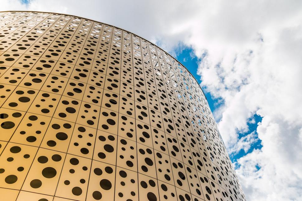 Free Image of Tall Building With Numerous Holes 