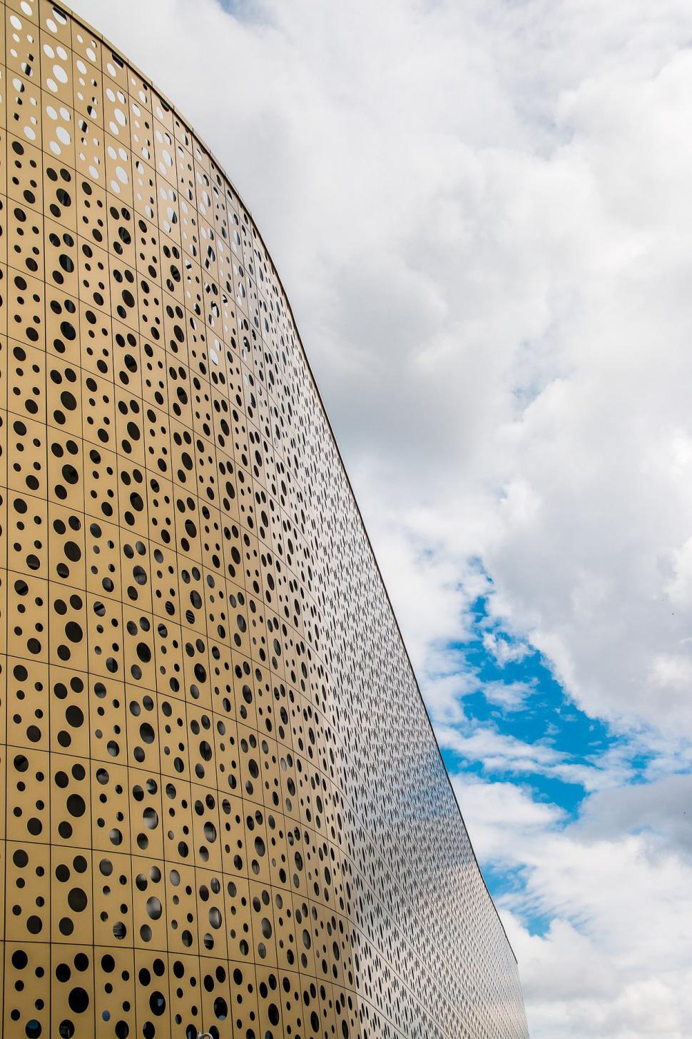 Free Image of Tall Building With Holes 