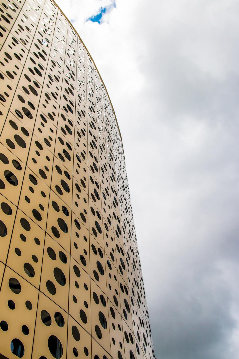 Free Image of Tall Building With Holes 