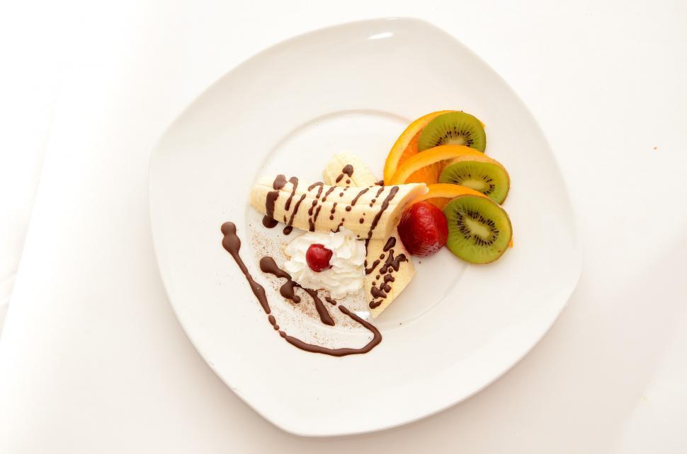 Free Image of White Plate With Fruit-Topped Dessert 
