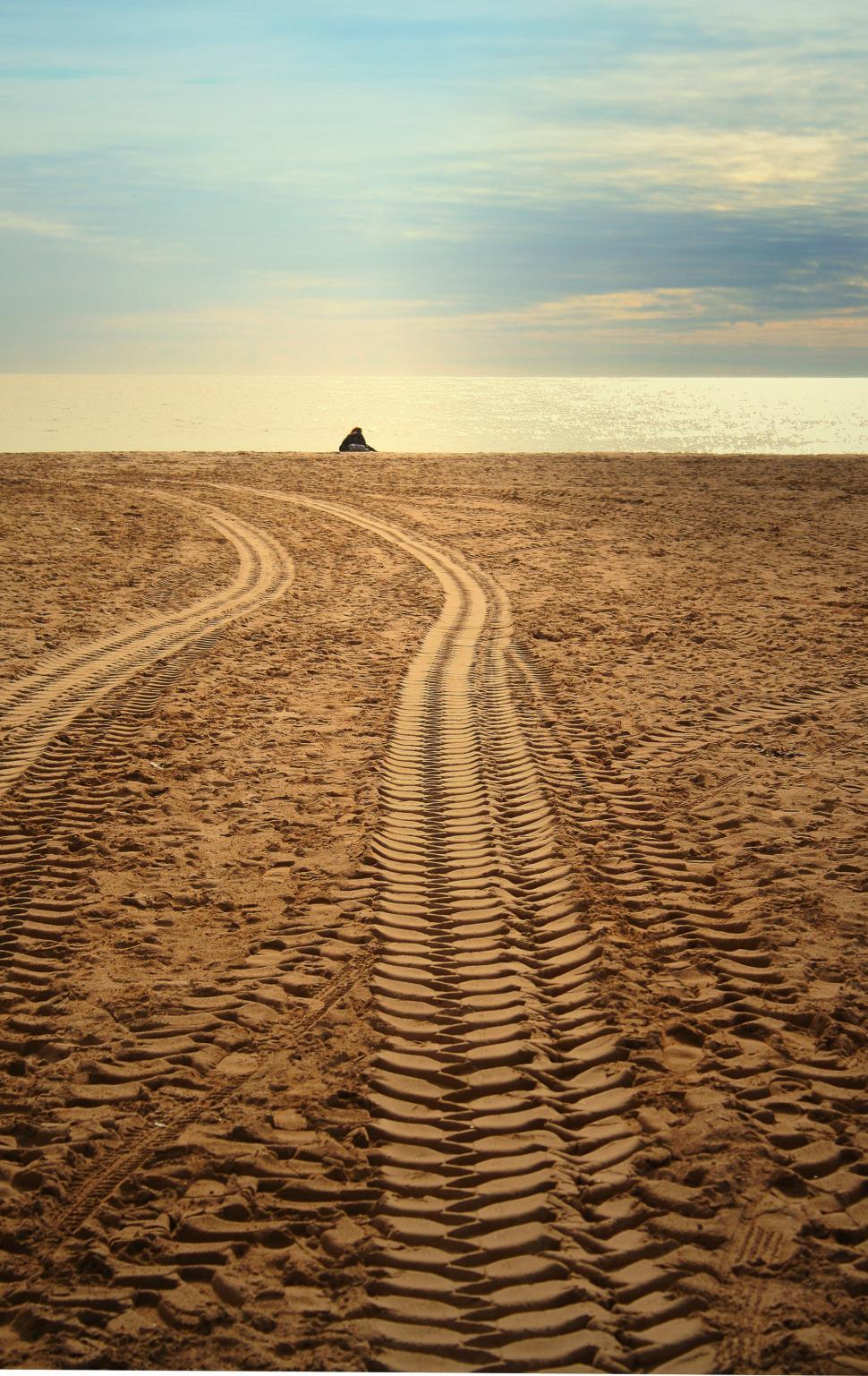 Free Image of Tire Track in the Sand on a Beach 