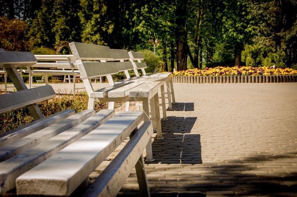 Free Image of A Row of White Benches 