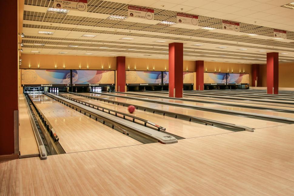 Free Image of Bowling Alley With Bowling Balls in the Lanes 