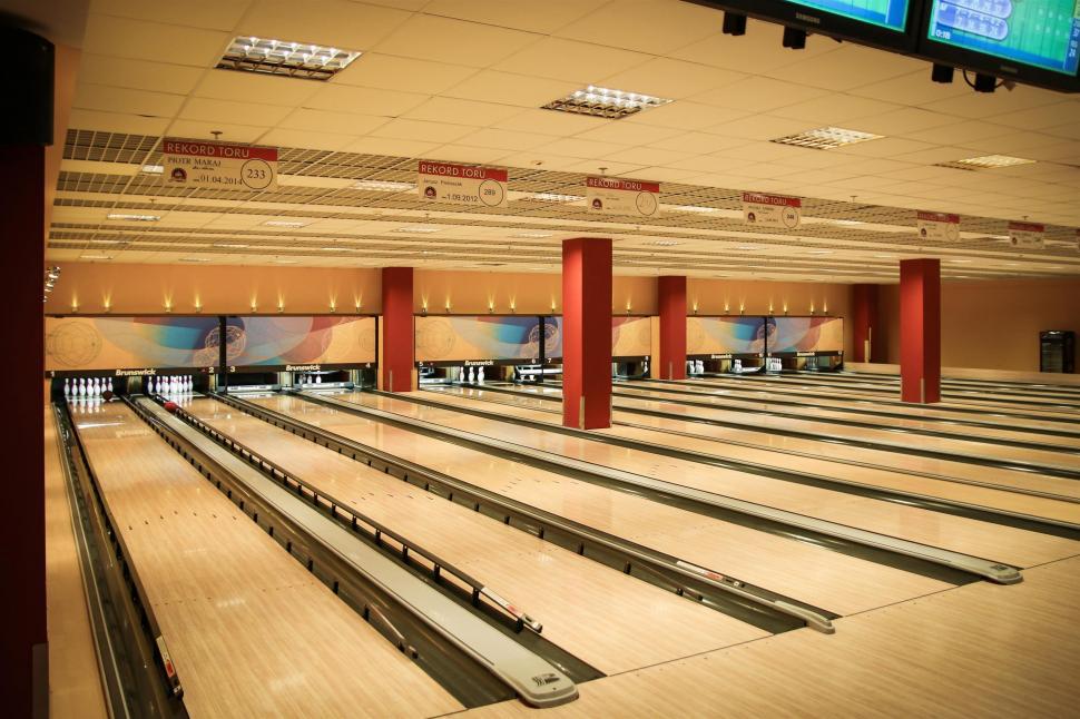 Free Image of Bowling Alley Filled With Bowling Pins and Bowling Balls 