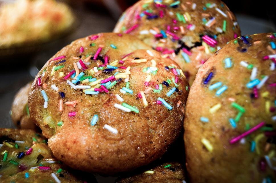 Free Image of A Pile of Colorful Sprinkled Donuts 