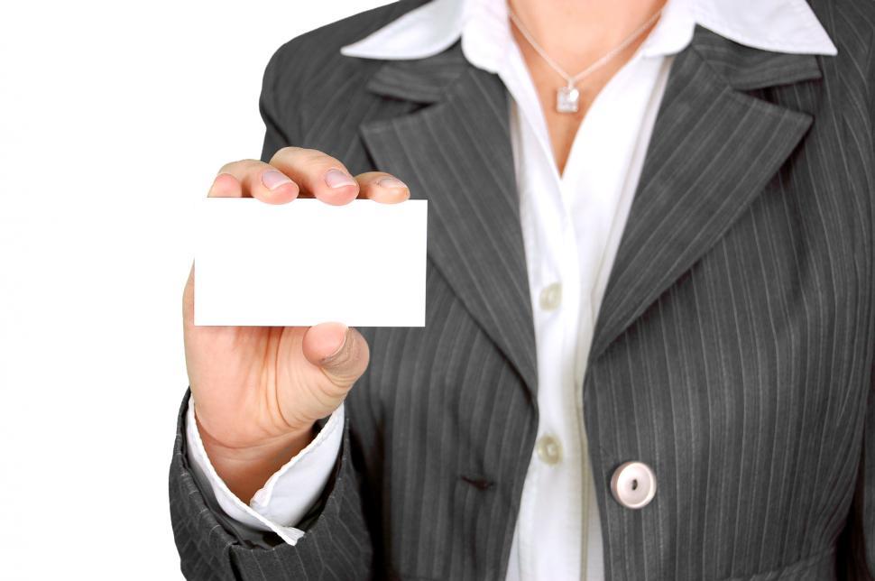 Free Image of Woman in Business Suit Holding Business Card 