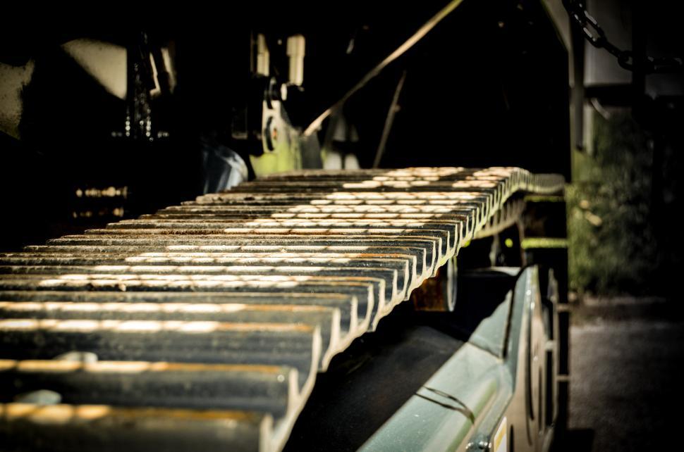 Free Image of Conveyor Belt in Factory Filled With Metal Bars 