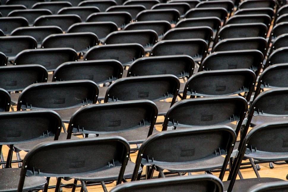 Free Image of Row of Black Chairs in a Conference Room 