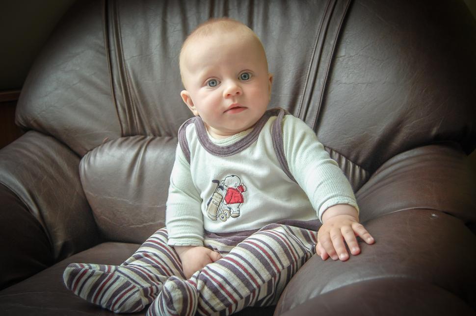 Free Image of Baby Sitting in Leather Chair 