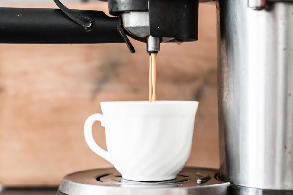 Free Image of Pouring Coffee Into Coffee Maker 