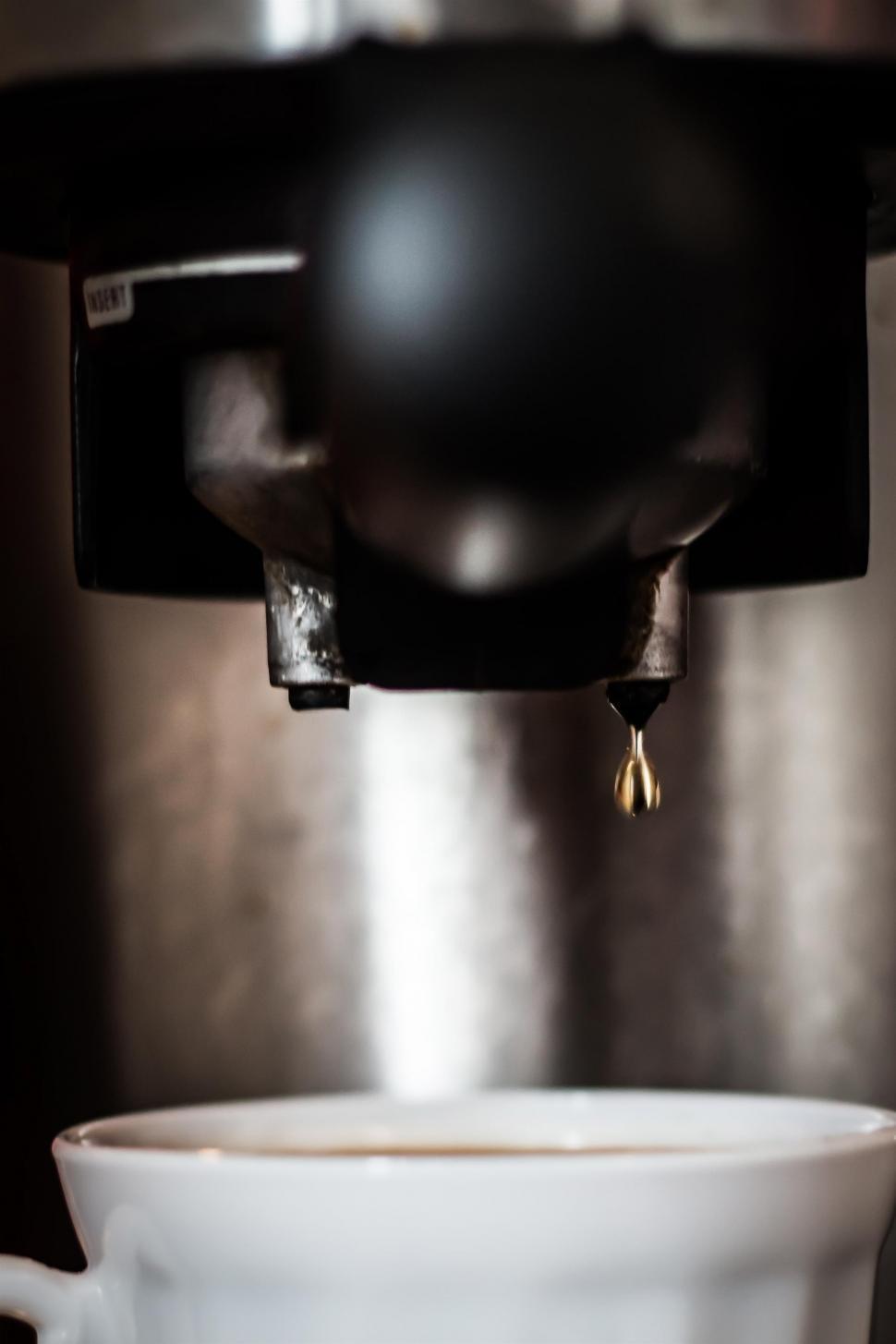 Free Image of Coffee Cup Being Filled With Water 