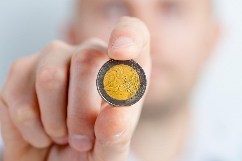 Free Image of Person Holding a Coin in Hand 