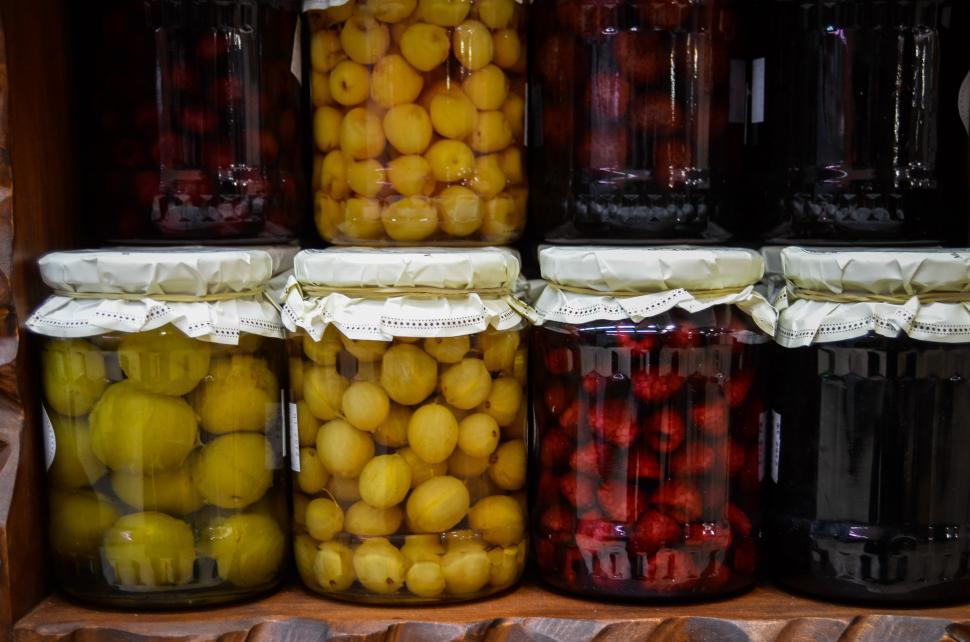 Free Image of Jars Filled With Fruit on Shelf 