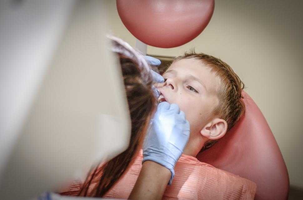 Free Image of Man Blowing Balloon in Dentists Chair 