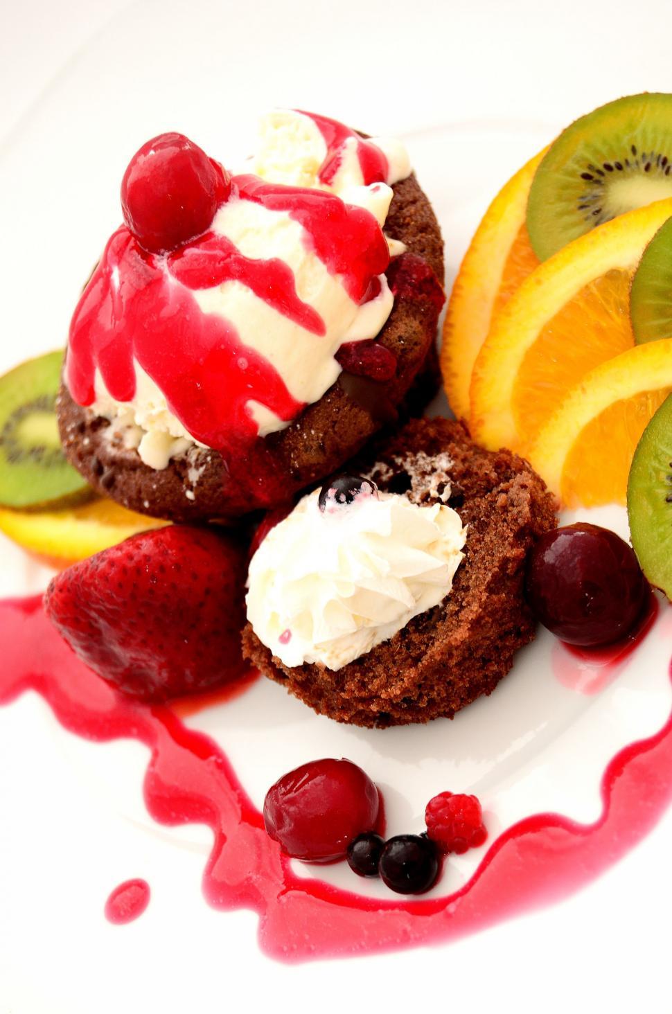 Free Image of White Plate Topped With Fruit and Ice Cream 