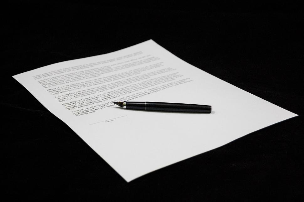 Free Image of Pen Resting on Top of Paper 