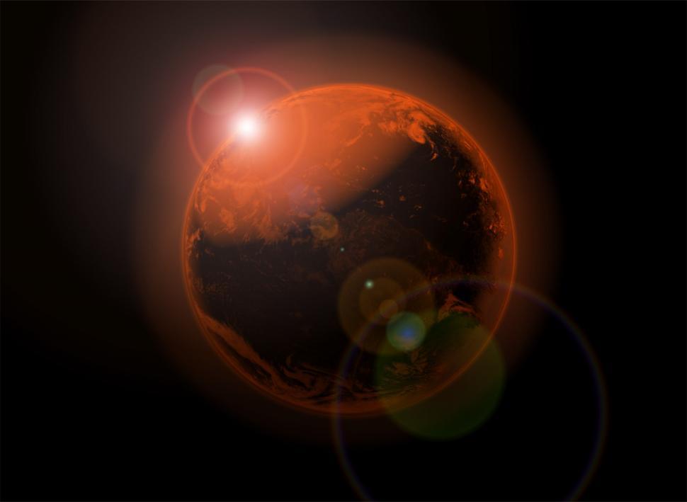 Free Image of Bright Light Emitting From Center of a Planet 