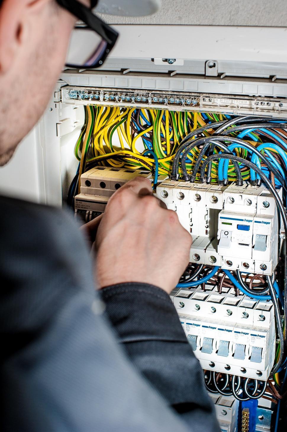 Free Image of Man Working on Electrical Panel 