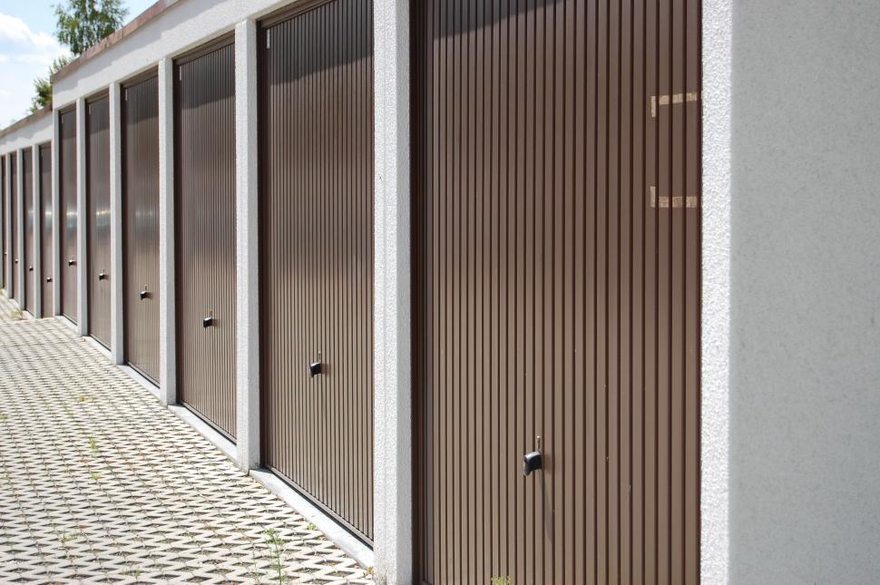 Free Image of Row of Closed Doors on Building Side 