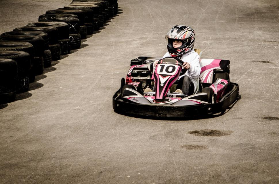 Free Image of Person Riding a Go Kart on Race Track 