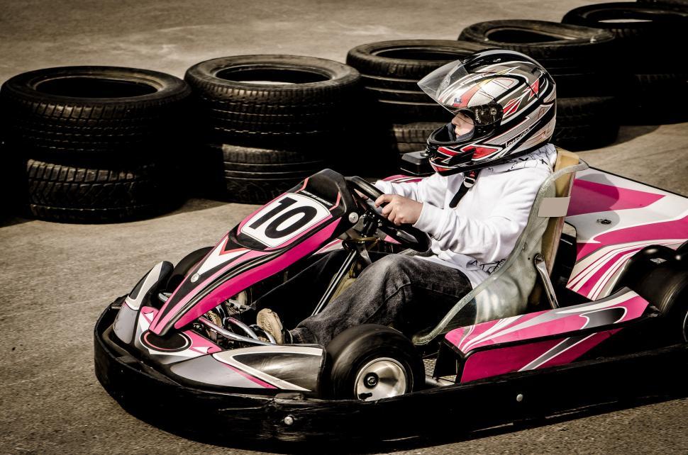 Free Image of Person Riding Go Kart With Helmet On 