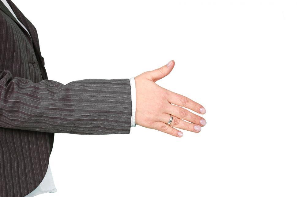 Free Image of Businessman in Suit and Tie Holding Out Hand 
