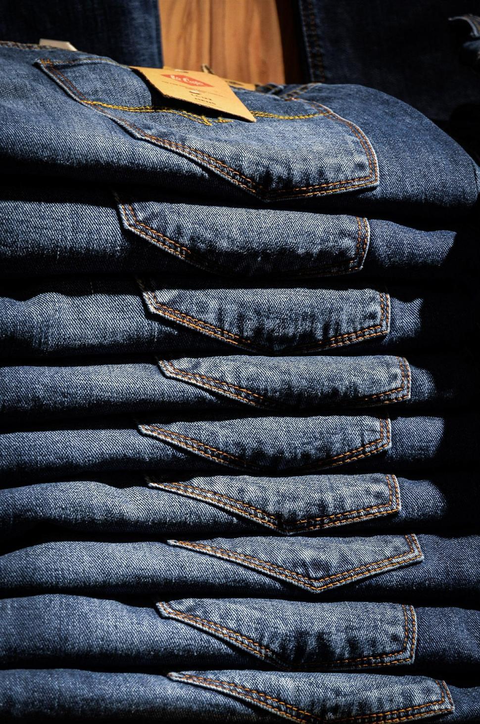 Free Image of Pile of Blue Jeans Arranged Neatly 
