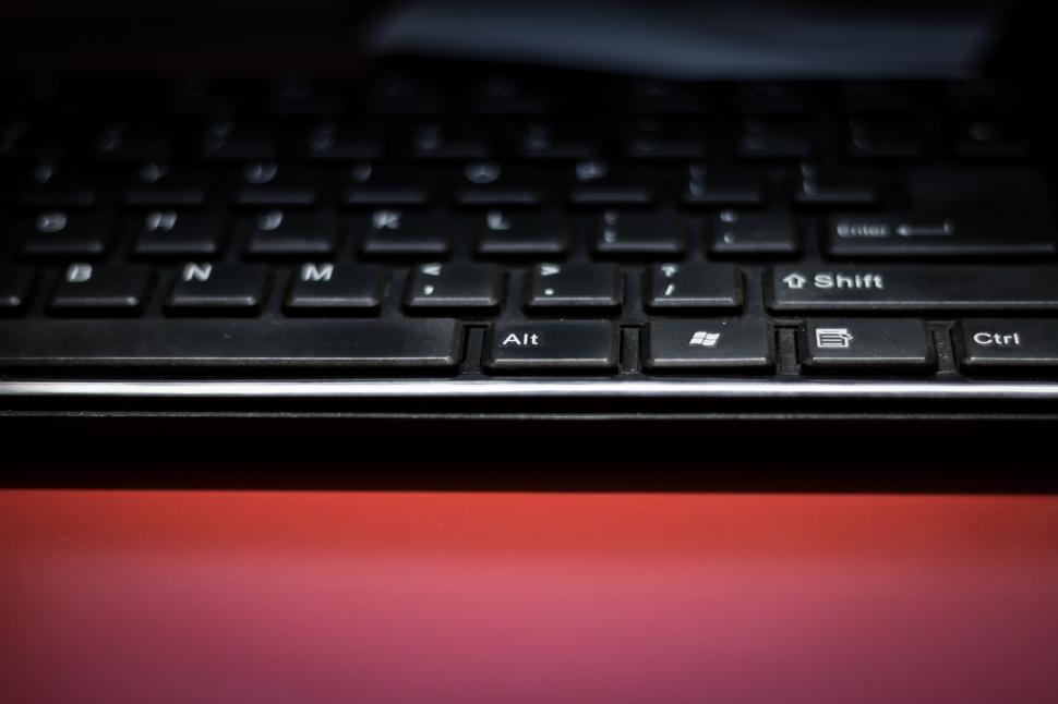 Free Image of Computer Keyboard on Red Desk 