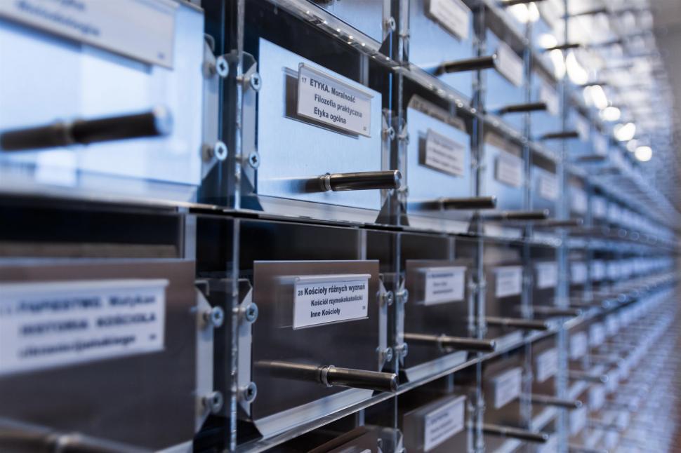 Free Image of Organized Stack of File Cabinets With Labels 