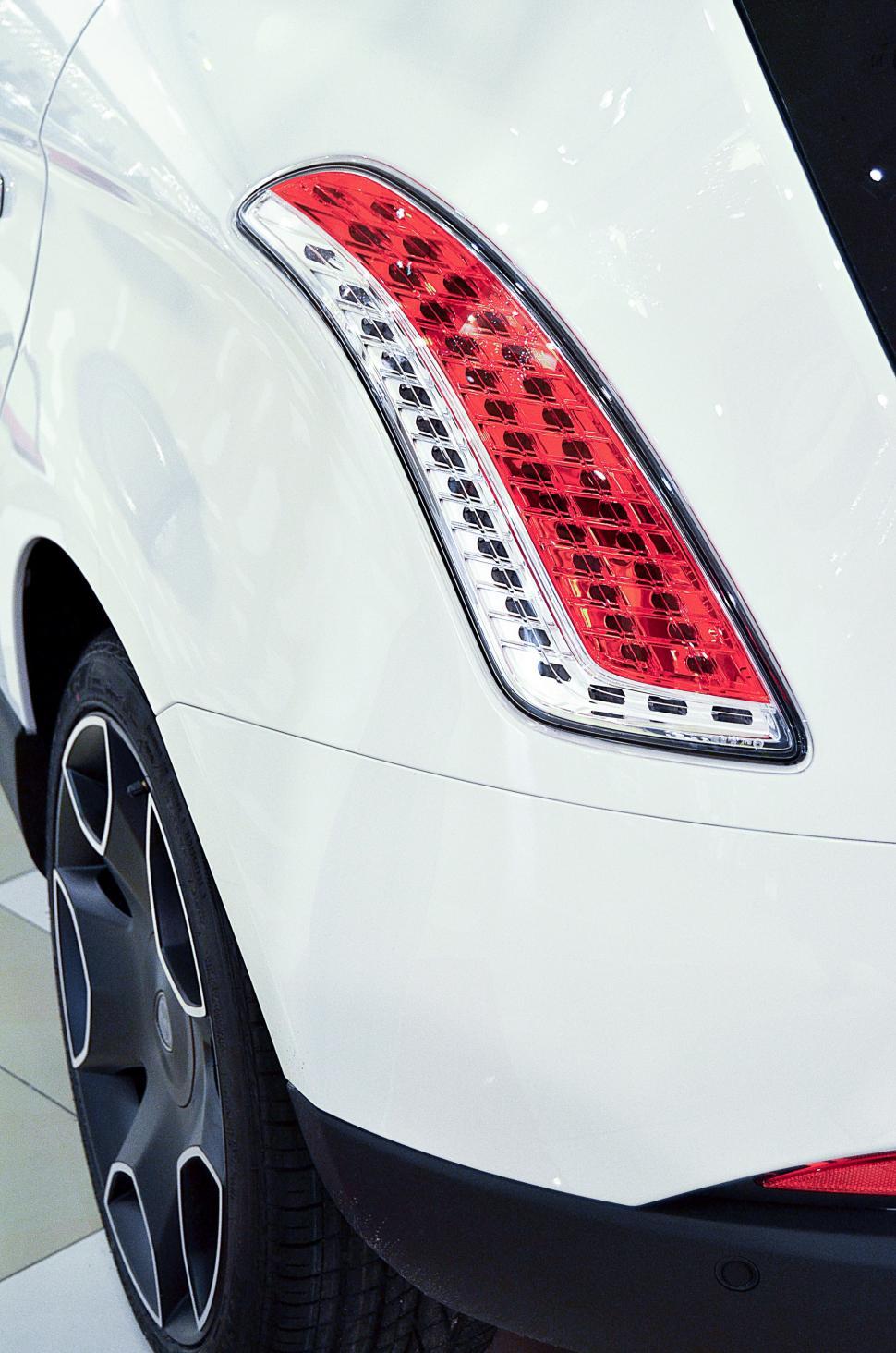 Free Image of Close Up of the Tail Lights of a White Car 