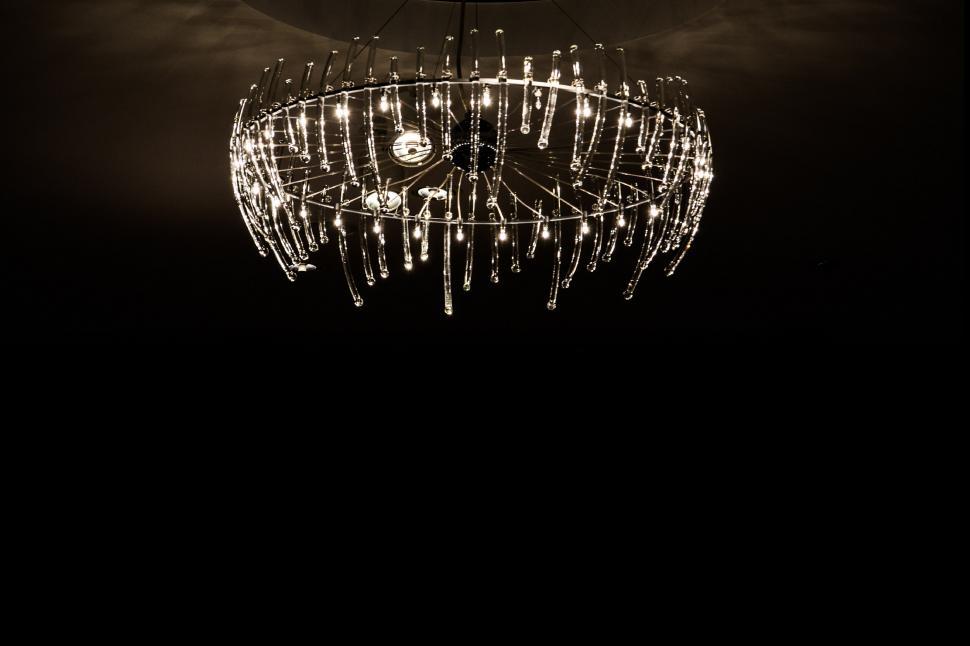 Free Image of Chandelier Hanging From Ceiling in Dark Room 