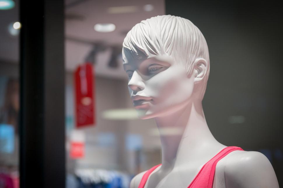 Free Image of White Mannequin in a Store Window 