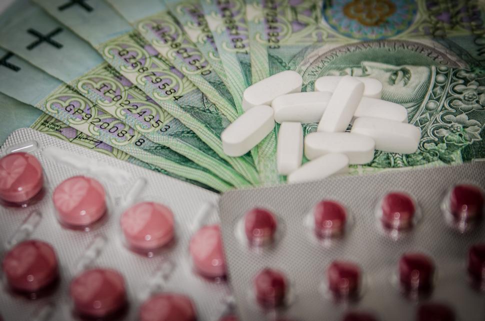 Free Image of Pills and Money on Table 