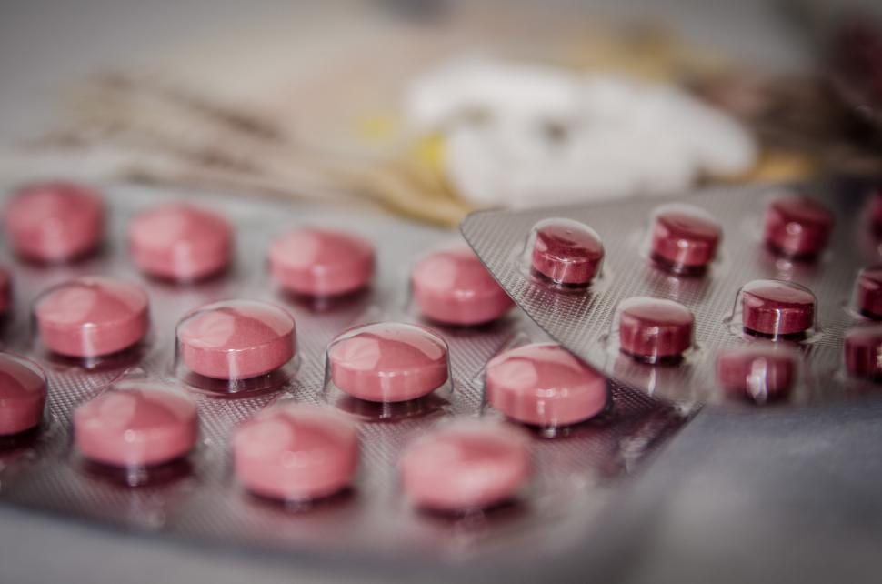 Free Image of Close Up of Pink Pills on a Table 