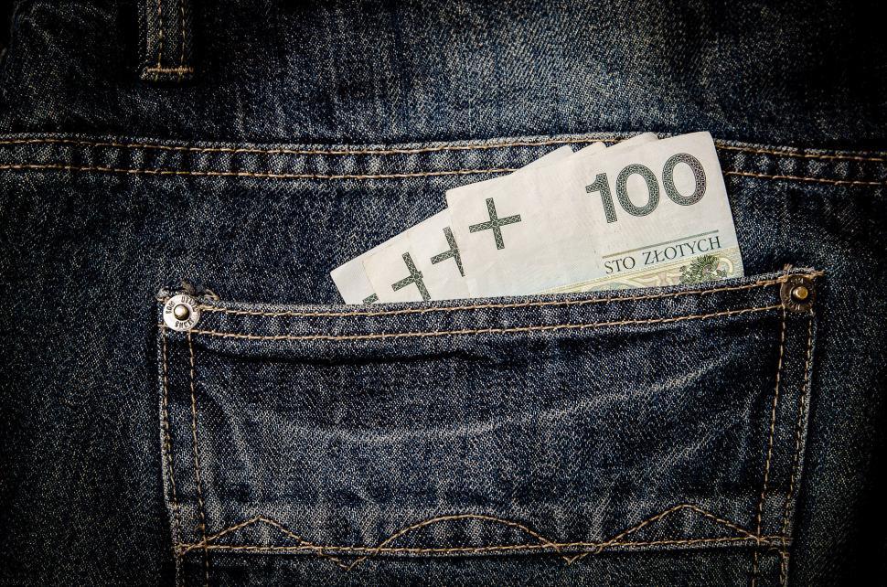 Free Image of Hundred Dollar Bill in Back Pocket of Jeans 