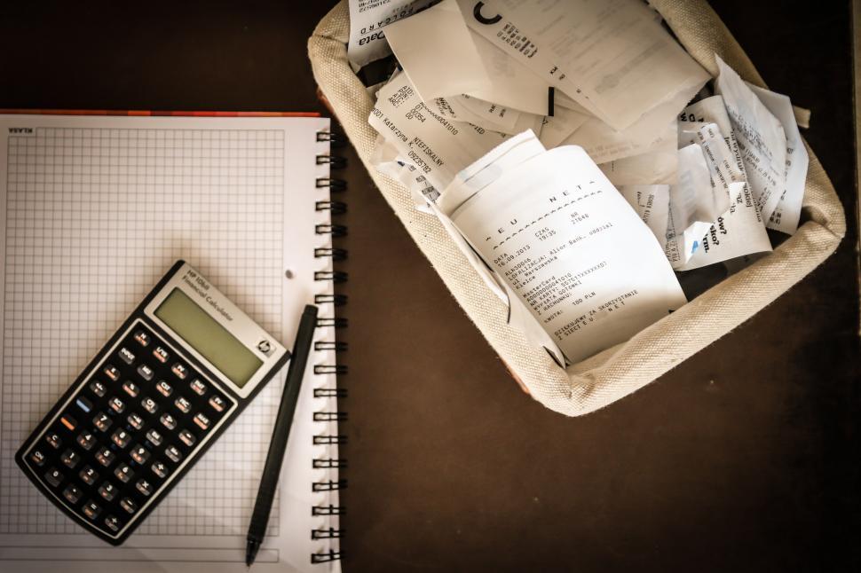 Free Image of Pen, Calculator, and Notebook on Desk 