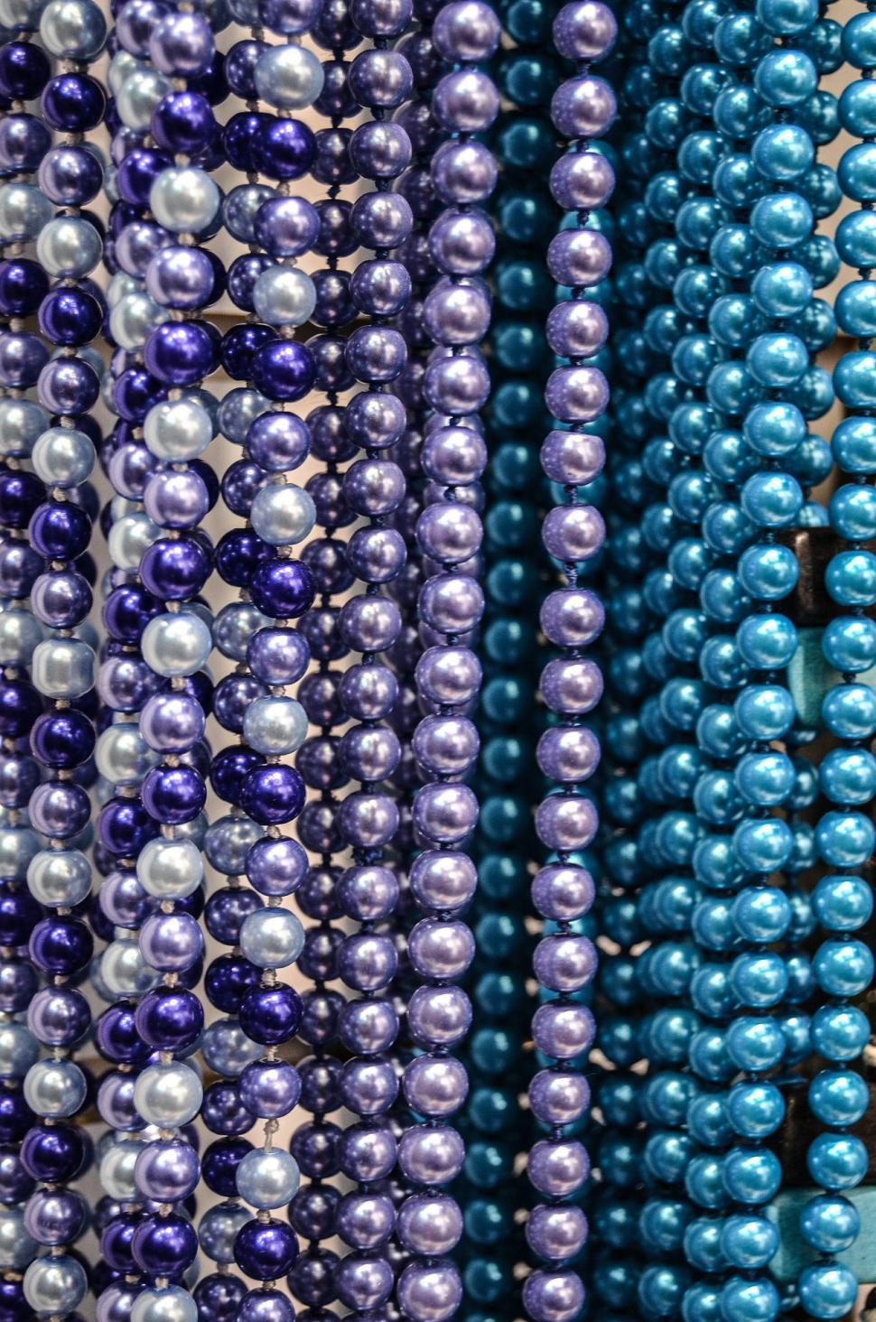 Free Image of Array of Beads Hanging on Wall 