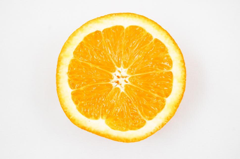 Free Image of Orange Cut in Half on White Background 