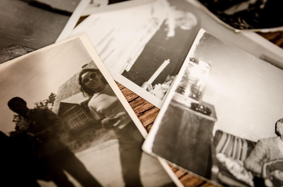 Free Image of A Pile of Old Black and White Photographs 