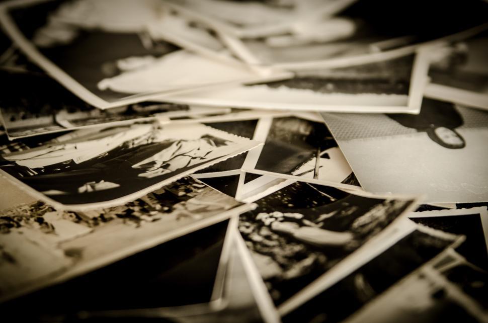 Free Image of Stack of Black and White Photos on Table 