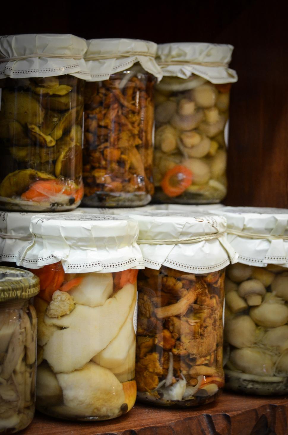 Free Image of Shelf Filled With Jars of Various Foods 