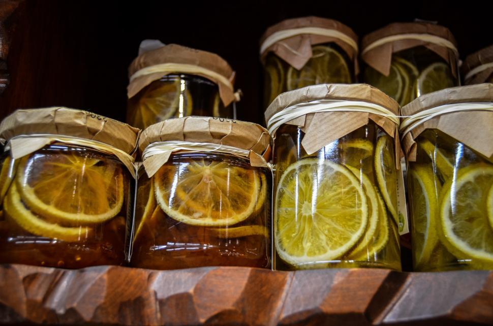 Free Image of Jars Filled With Sliced Lemons and Honey on Shelf 