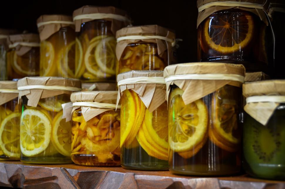 Free Image of Shelf Filled With Jars of Various Fruits 
