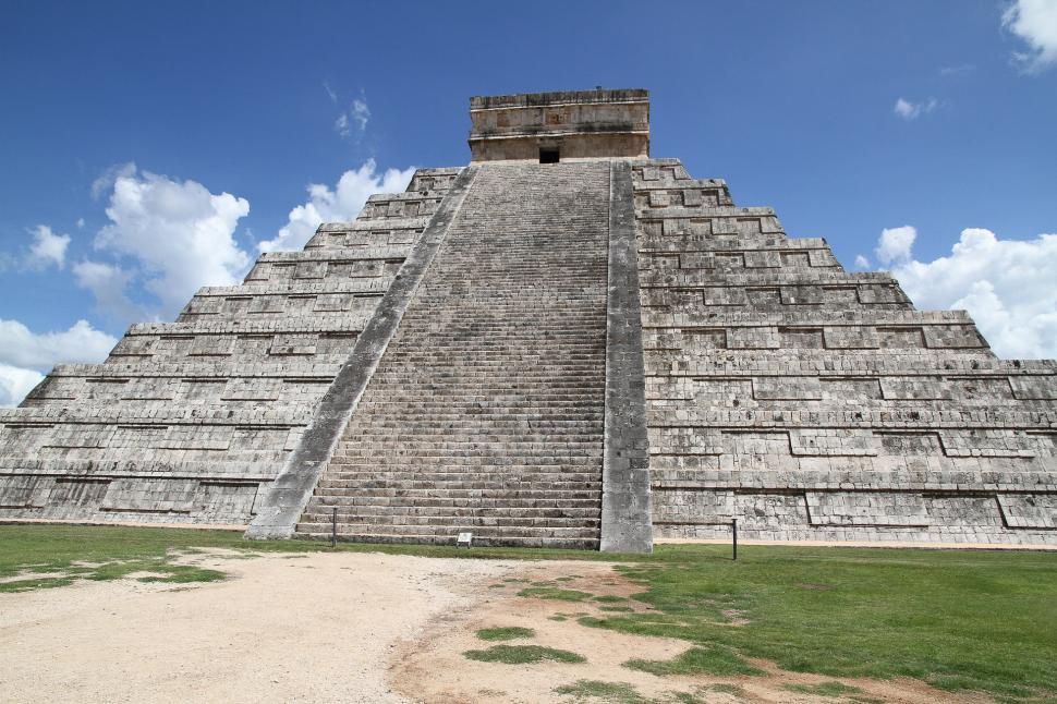 Free Image of Large Pyramid Standing in Field 